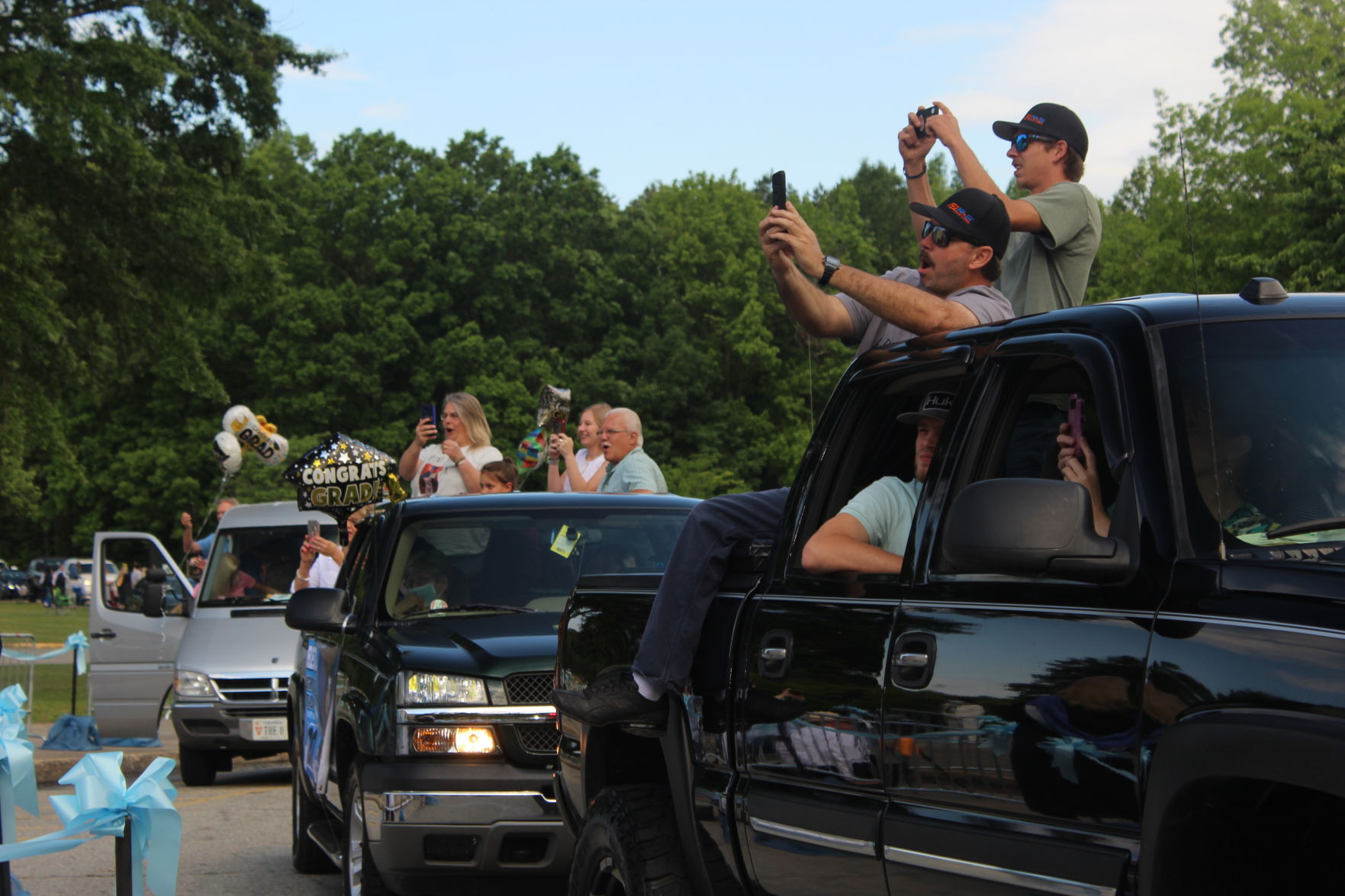 Families fill the back of trucks.JPG